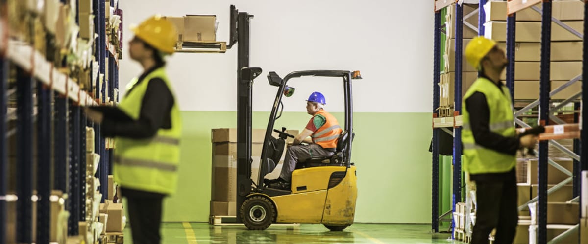 Workers in a lead acid battery facility