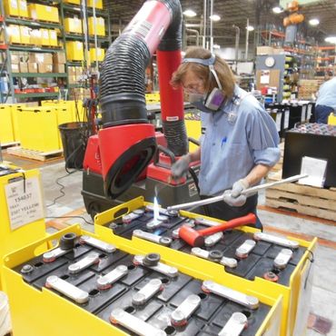 Crown Battery Employee Manufacturing 1 EEE Crown Battery Employee in Manufacturing Plant