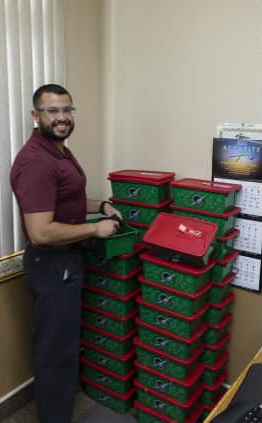 Operation Christmas Child Boxes Employee Organizes Operation Christmas Child Boxes